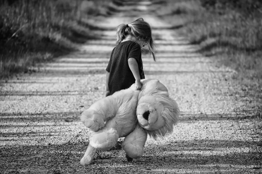 Girl holding her teddy bear